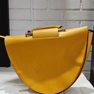 Sunny Yellow Half-Moon Handbag with Contrasting Black Accents